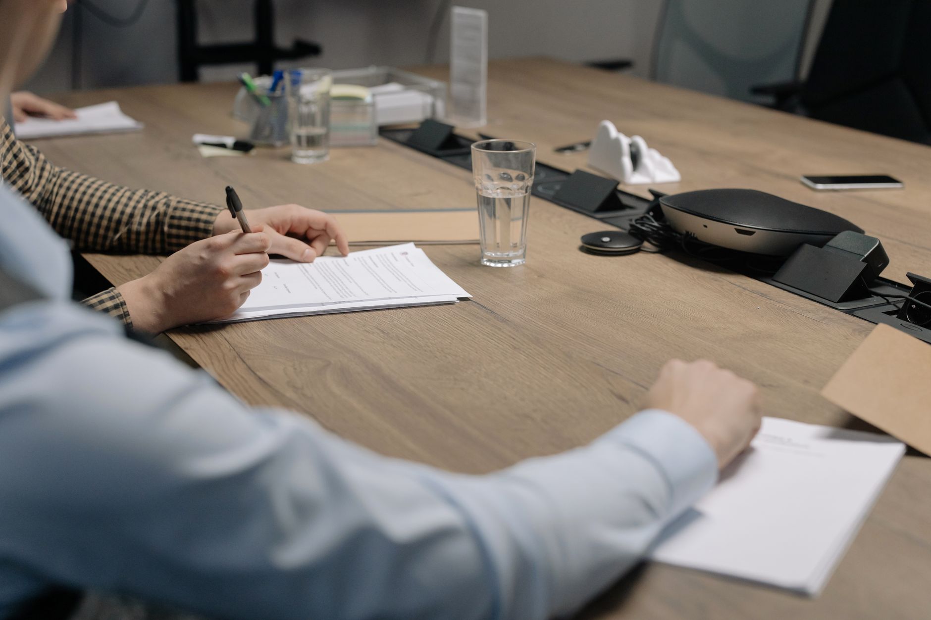 Executives and legal counsel discussing intercompany restructuring in an Istanbul office