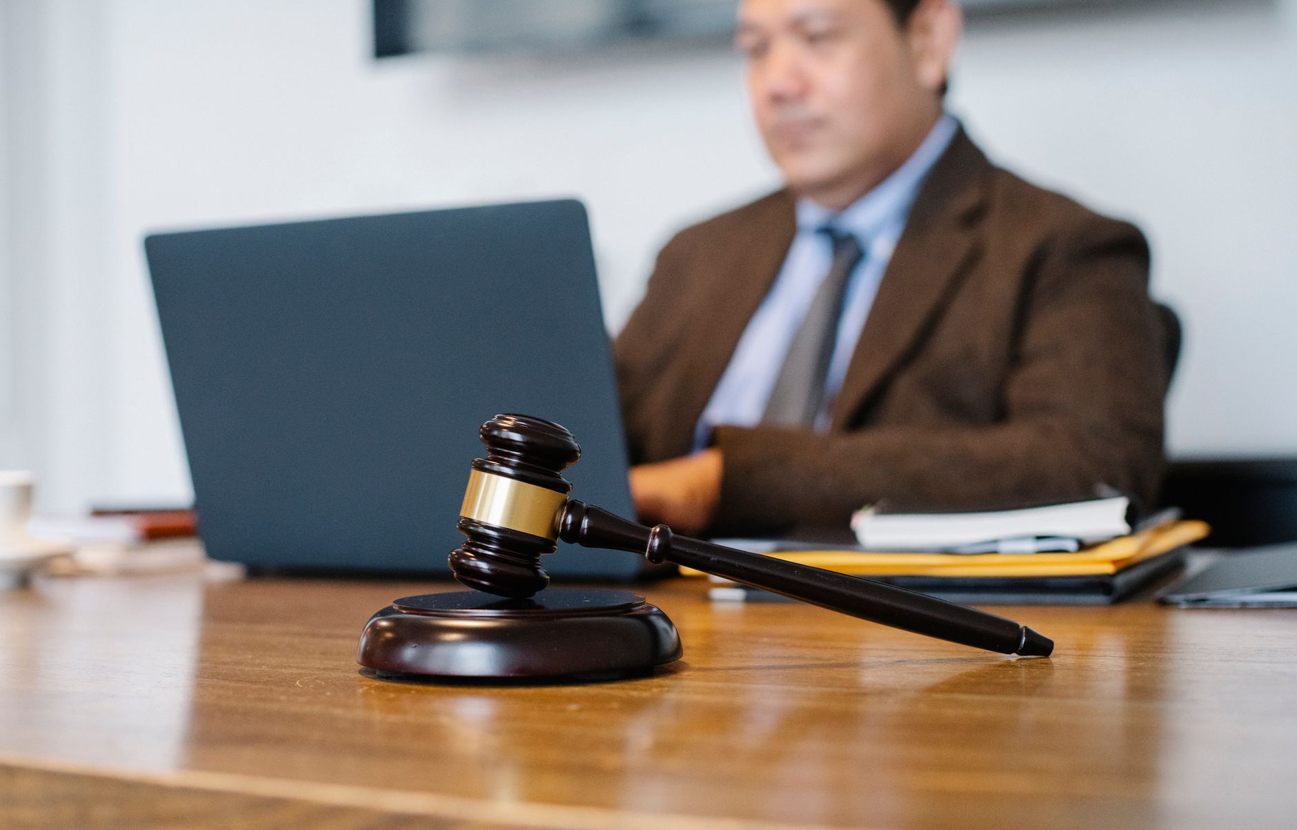 Lawyer using AI legal software on a laptop in an international law office
