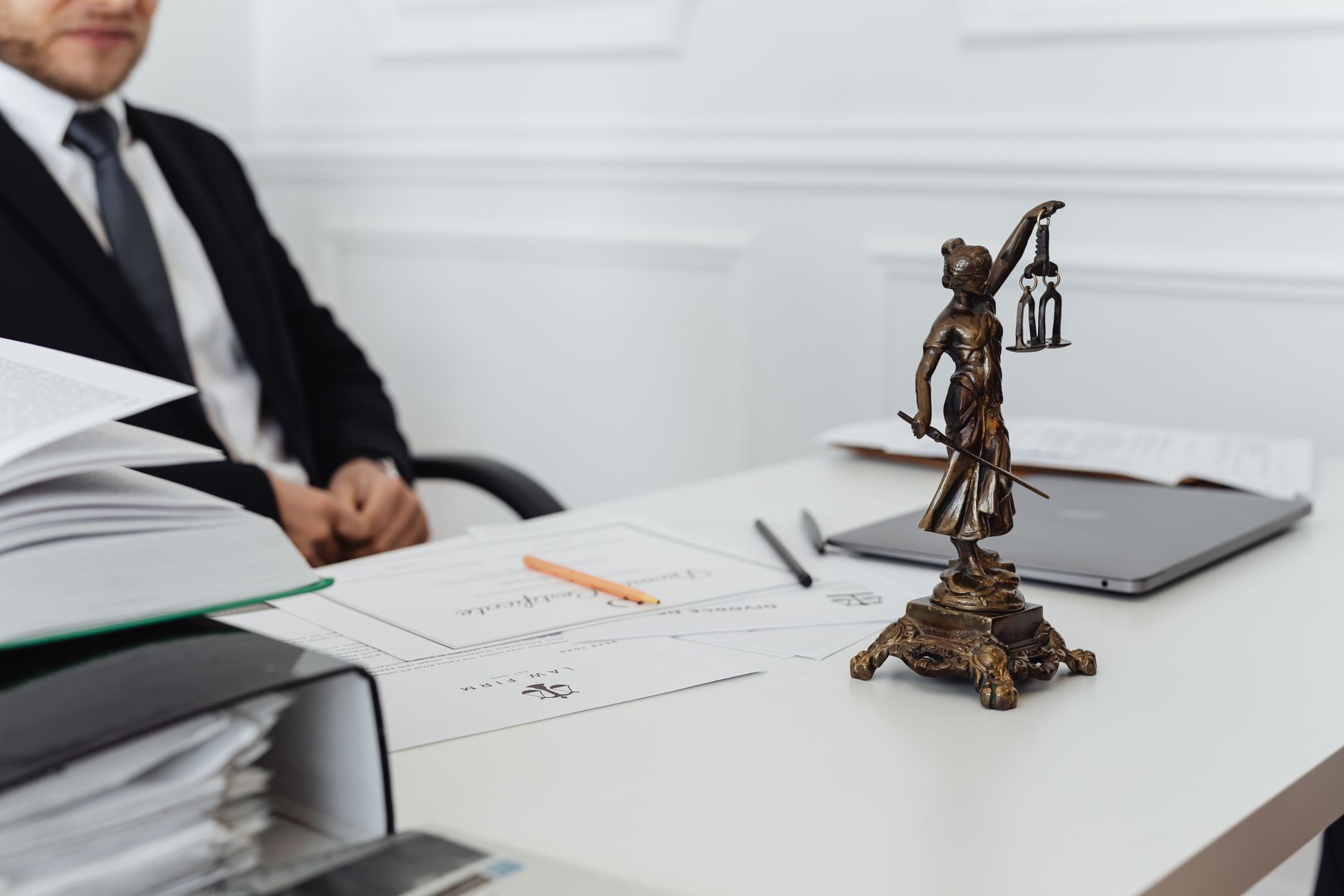 Tender documents with courthouse columns symbolising procurement suspension remedies