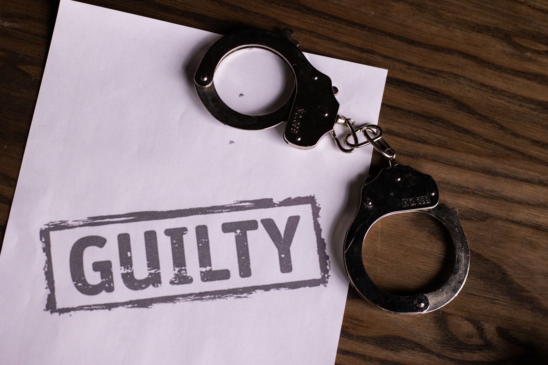 A visual representation of scales of justice balancing handcuffs on one side and legal documents on the other, set against a blurred background suggesting a global legal context, symbolizing the equilibrium between state power and individual liberty in pre-trial proceedings.